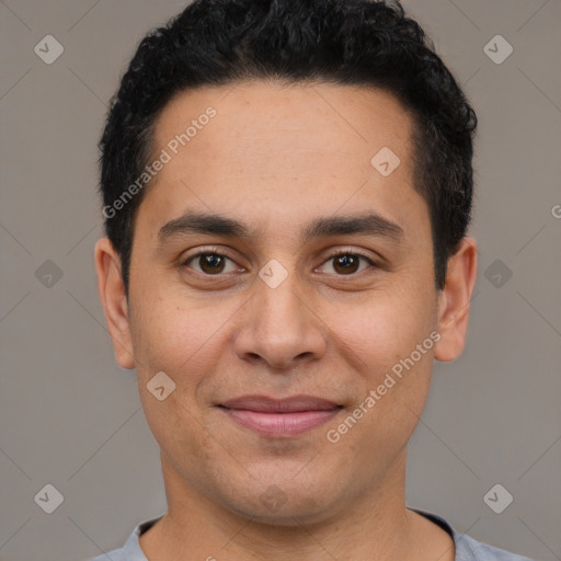 Joyful white young-adult male with short  black hair and brown eyes