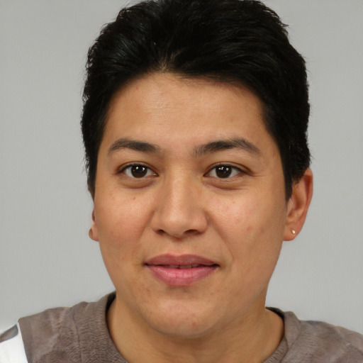Joyful asian adult female with short  brown hair and brown eyes