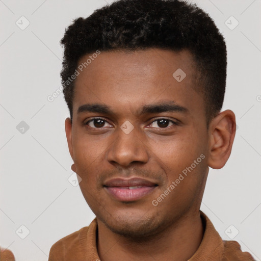 Joyful black young-adult male with short  brown hair and brown eyes