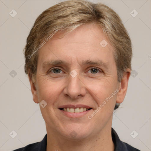 Joyful white adult male with short  brown hair and grey eyes