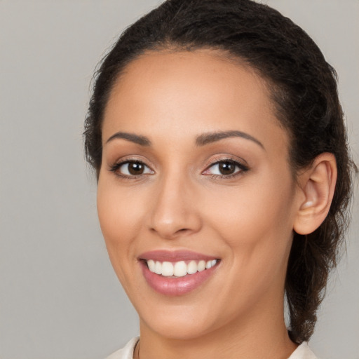 Joyful white young-adult female with medium  brown hair and brown eyes