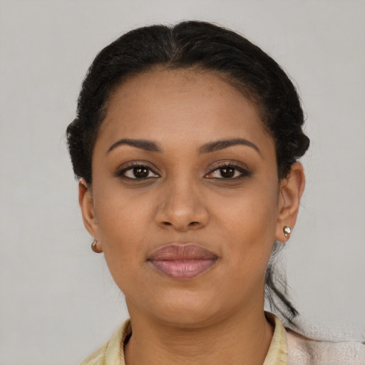 Joyful latino young-adult female with short  brown hair and brown eyes