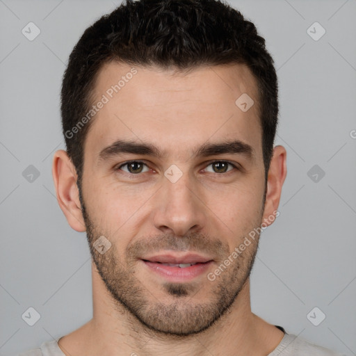 Joyful white young-adult male with short  brown hair and brown eyes