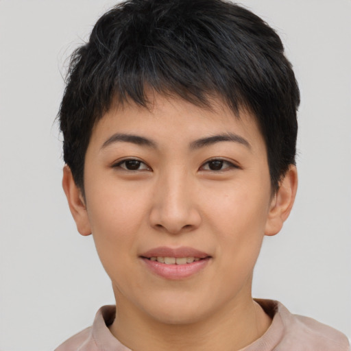 Joyful asian young-adult female with short  brown hair and brown eyes