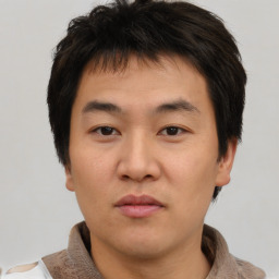 Neutral asian young-adult male with short  brown hair and brown eyes