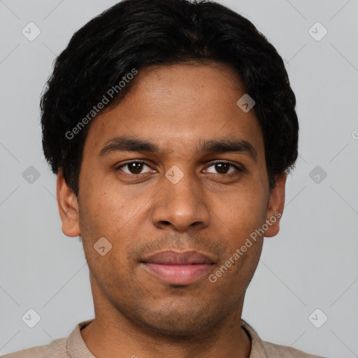 Joyful latino young-adult male with short  black hair and brown eyes