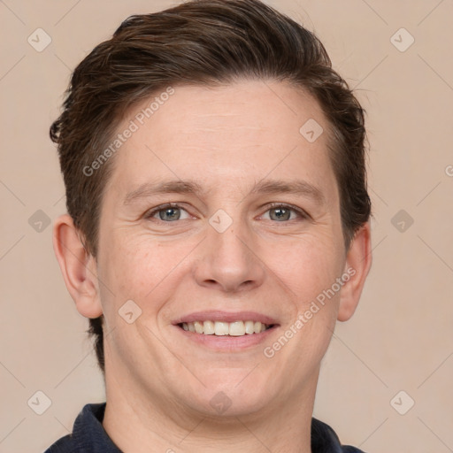 Joyful white adult male with short  brown hair and grey eyes