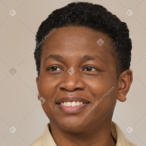 Joyful black young-adult male with short  brown hair and brown eyes