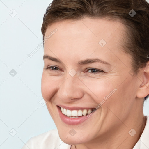 Joyful white young-adult female with short  brown hair and brown eyes