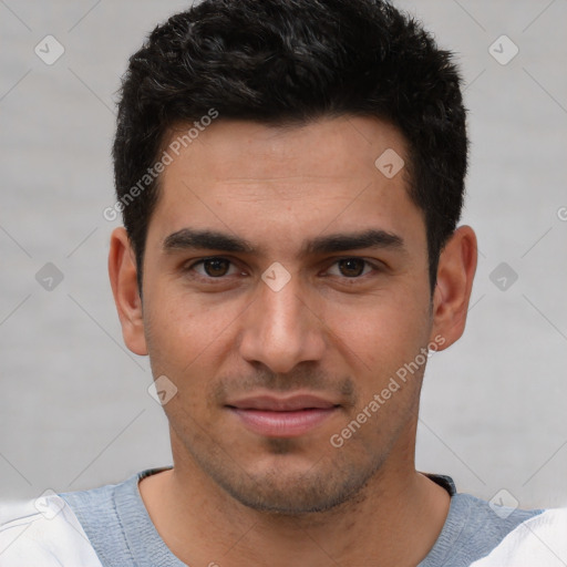 Joyful white young-adult male with short  black hair and brown eyes