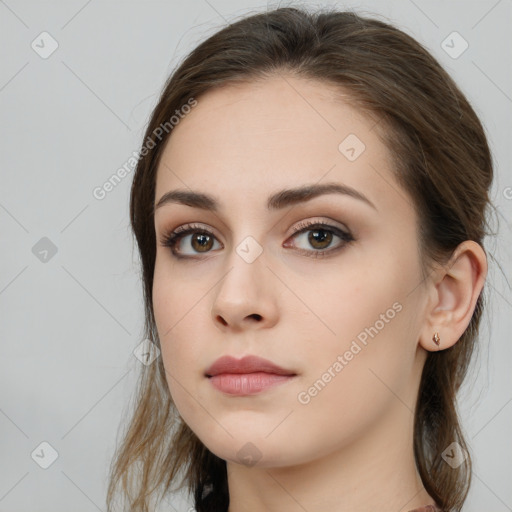 Neutral white young-adult female with long  brown hair and brown eyes