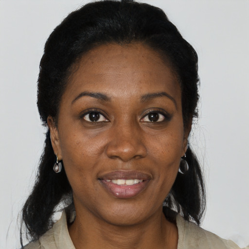 Joyful black adult female with medium  black hair and brown eyes
