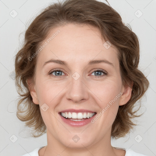 Joyful white young-adult female with medium  brown hair and green eyes