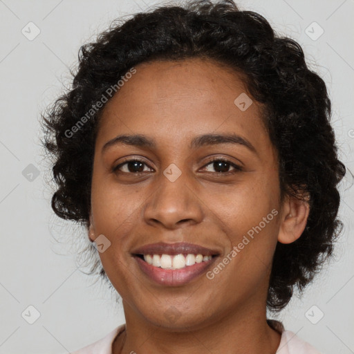 Joyful black young-adult female with long  brown hair and brown eyes