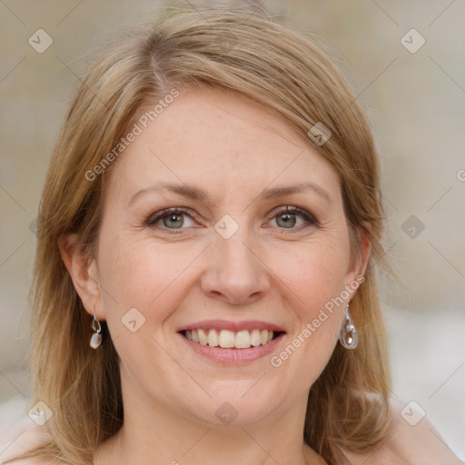 Joyful white adult female with medium  brown hair and grey eyes