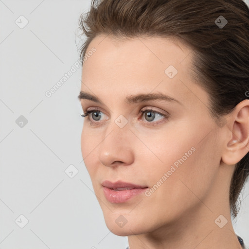 Neutral white young-adult female with medium  brown hair and grey eyes