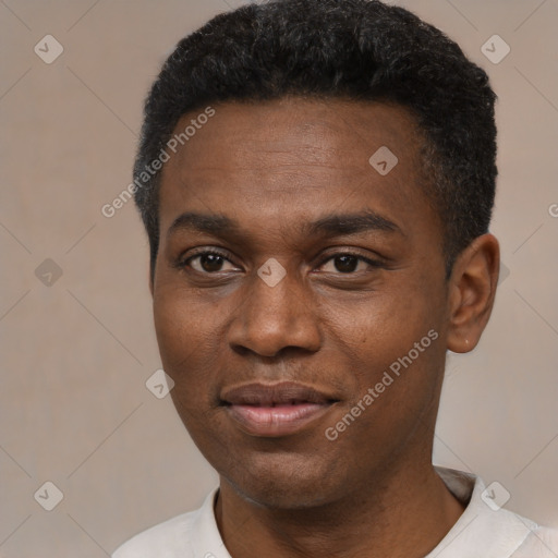 Joyful black young-adult male with short  black hair and brown eyes