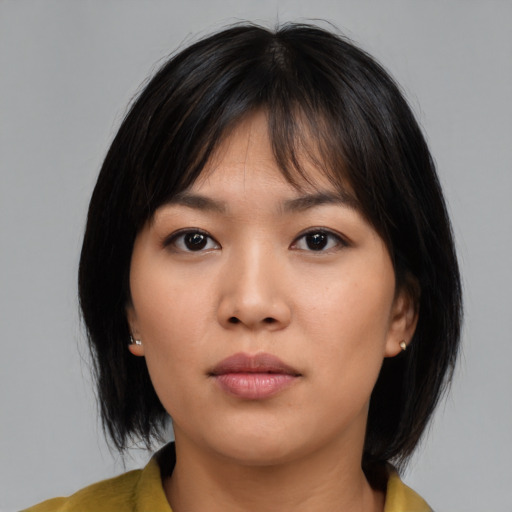 Neutral asian young-adult female with medium  brown hair and brown eyes