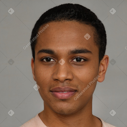 Joyful black young-adult male with short  black hair and brown eyes