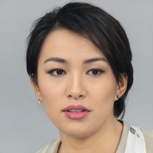 Neutral asian young-adult female with medium  black hair and brown eyes