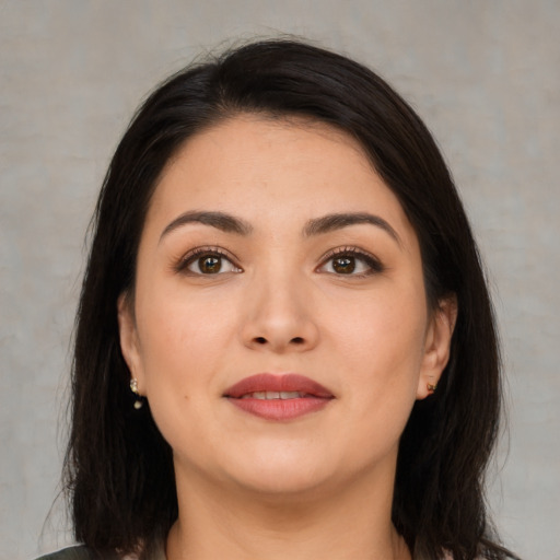 Joyful asian young-adult female with medium  brown hair and brown eyes