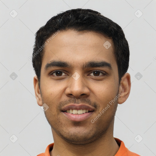 Joyful latino young-adult male with short  black hair and brown eyes