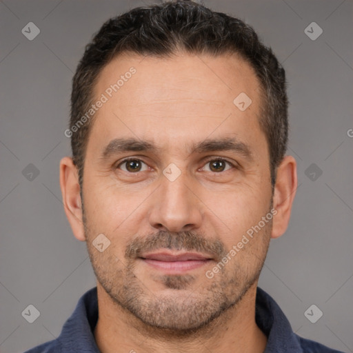 Joyful white adult male with short  brown hair and brown eyes