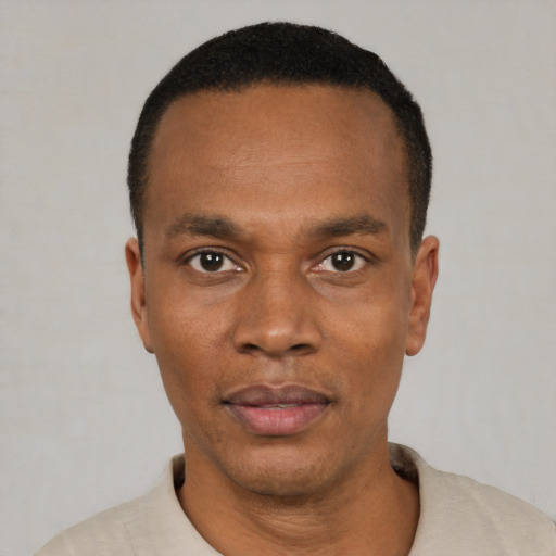 Neutral black adult male with short  black hair and brown eyes