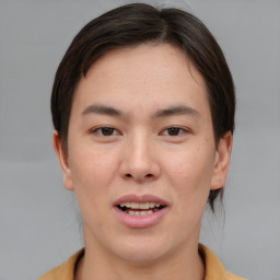 Joyful asian young-adult female with short  brown hair and brown eyes