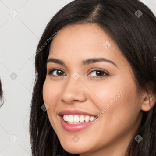 Joyful white young-adult female with long  brown hair and brown eyes