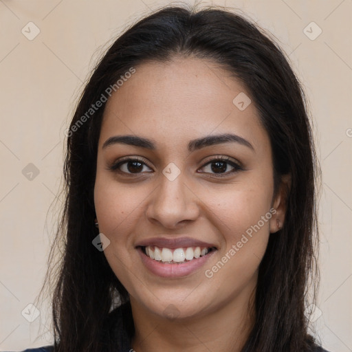 Joyful latino young-adult female with long  brown hair and brown eyes