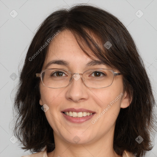 Joyful white adult female with medium  brown hair and brown eyes