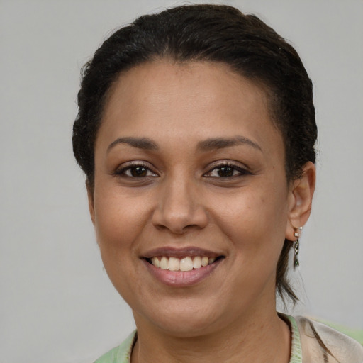 Joyful white young-adult female with short  brown hair and brown eyes