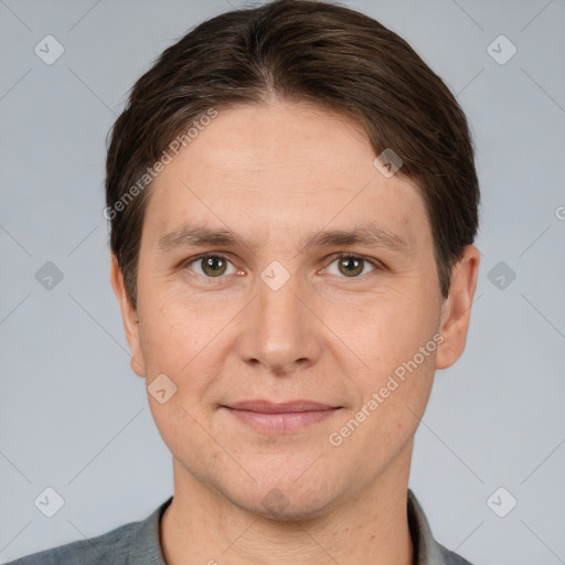 Joyful white adult male with short  brown hair and brown eyes