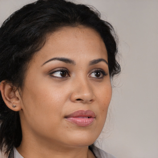 Neutral latino young-adult female with medium  brown hair and brown eyes