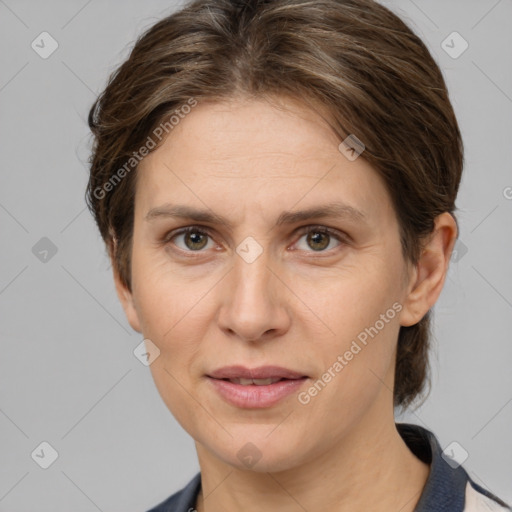 Joyful white adult female with medium  brown hair and grey eyes