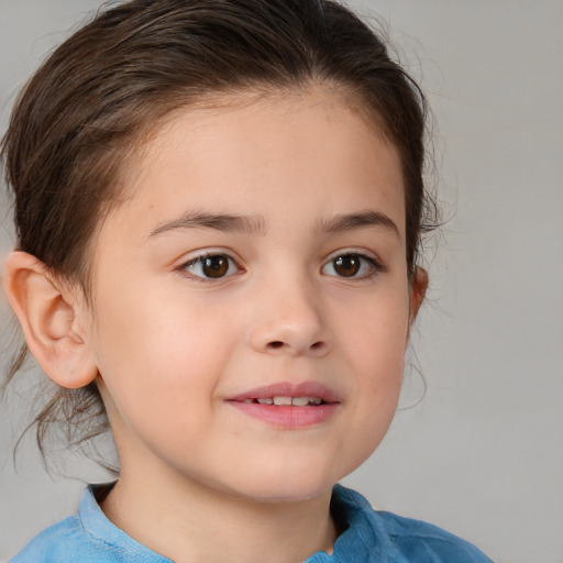 Joyful white child female with medium  brown hair and brown eyes