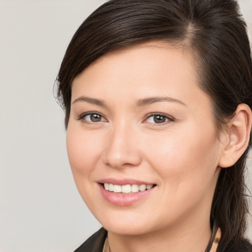 Joyful white young-adult female with medium  brown hair and brown eyes