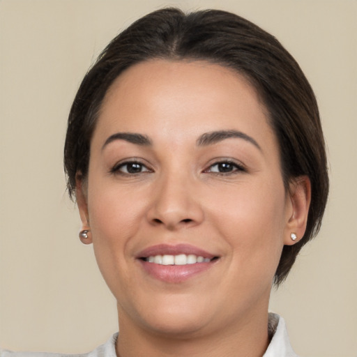 Joyful white young-adult female with medium  brown hair and brown eyes