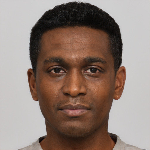 Neutral black young-adult male with short  black hair and brown eyes