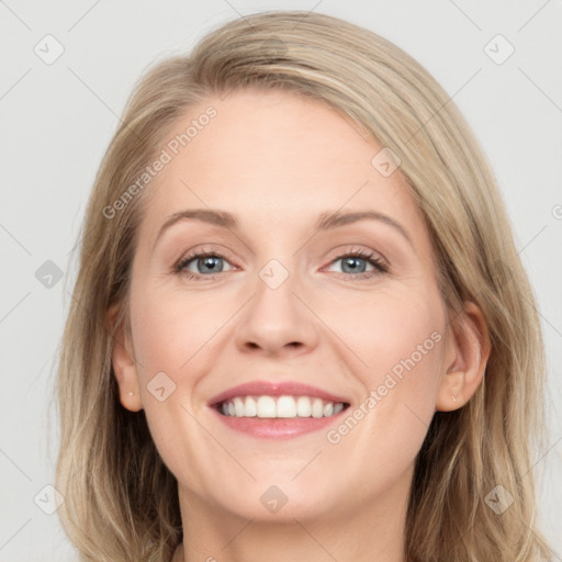 Joyful white young-adult female with long  brown hair and blue eyes