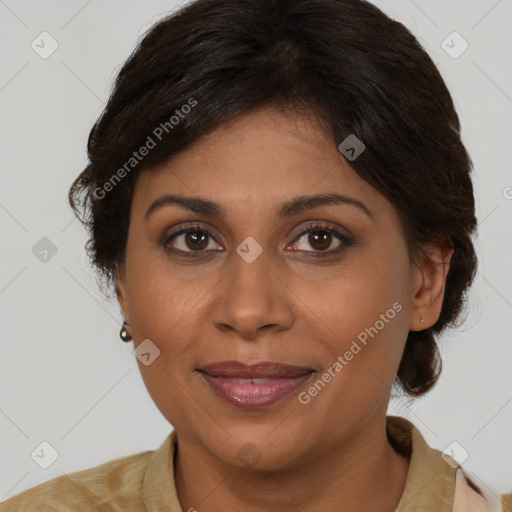 Joyful latino adult female with medium  brown hair and brown eyes