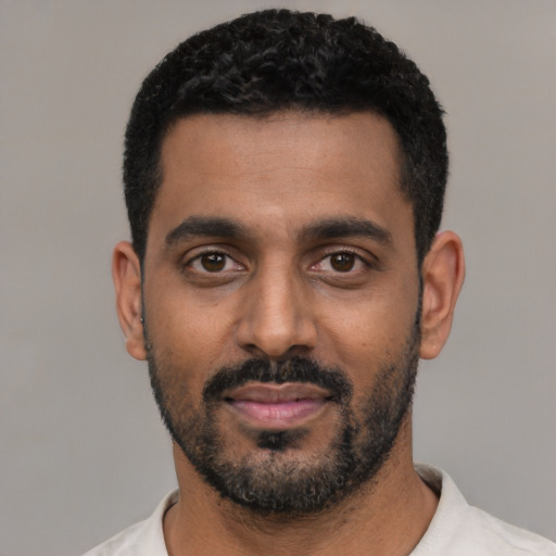 Neutral black young-adult male with short  black hair and brown eyes