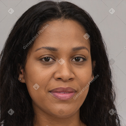 Joyful black young-adult female with long  brown hair and brown eyes