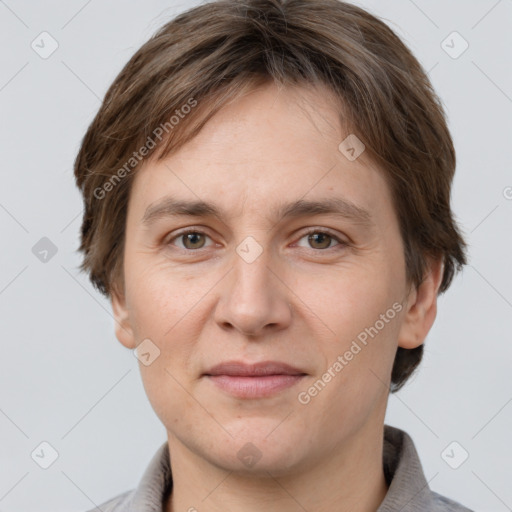 Joyful white adult female with short  brown hair and grey eyes