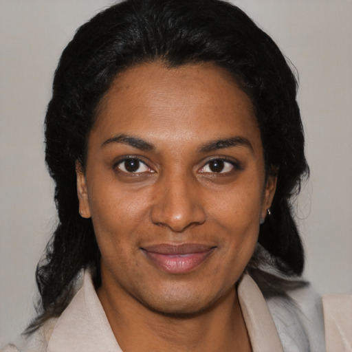Joyful black young-adult female with medium  black hair and brown eyes