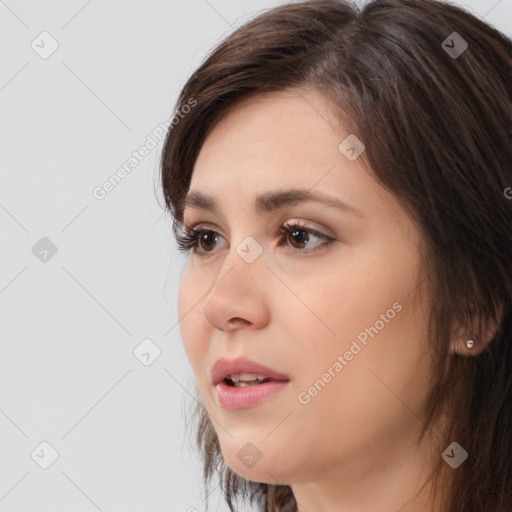 Neutral white young-adult female with long  brown hair and brown eyes