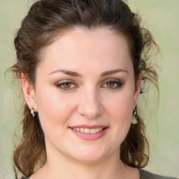 Joyful white young-adult female with medium  brown hair and green eyes