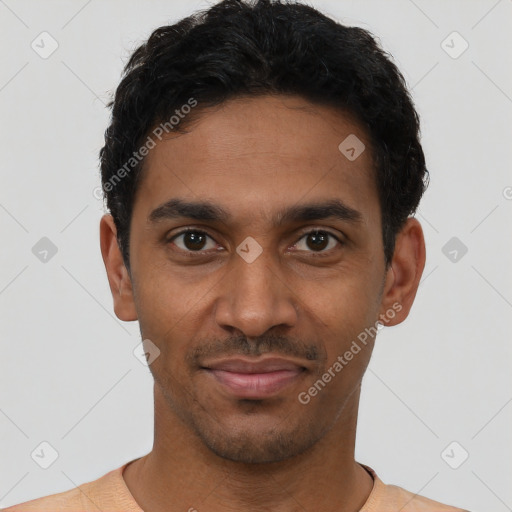 Joyful latino young-adult male with short  black hair and brown eyes
