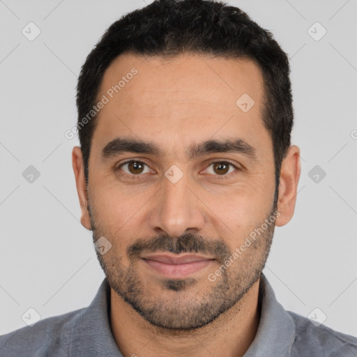 Joyful white young-adult male with short  black hair and brown eyes